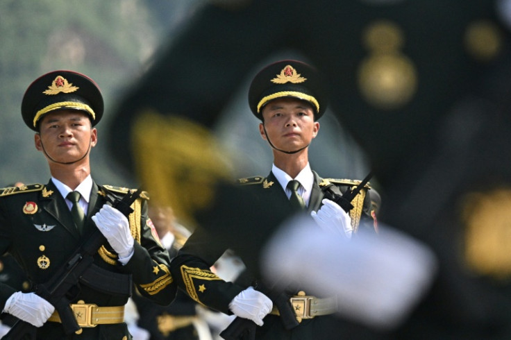 Chinese military personnel sweated through a rehearsal in Beijing for a parade in September to commemorate the 80th anniversary of the end of World War II
