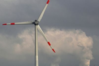 A wind turbine and a lignite-fired power plant near Neurath, western Germany