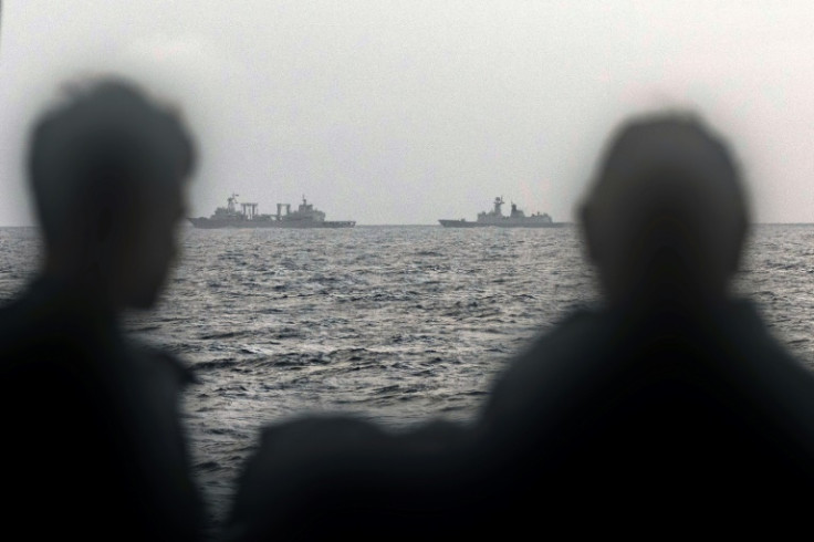 Members of the Australian navy watch the Chinese naval task group operating near Australia and New Zealand earlier this year