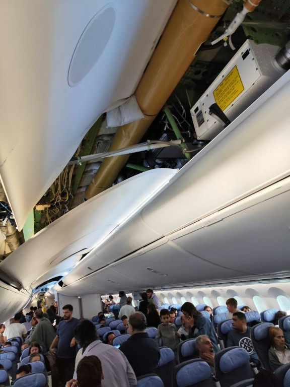 This UGC picture taken on July 1, 2024 and released as a courtesy by passenger Claudio Fernandez Arbes shows damages in an Air Europa Boeing 787-9 Dreamliner after it made an emergency landing in Natal, in northern Brazil, on July 1, 2024, after hitting s