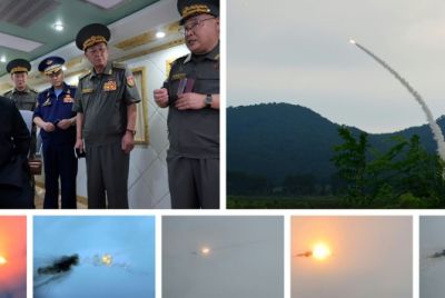A combination picture released by North Korean state media shows Kim Jong Un inspecting the firing of new air defence missiles