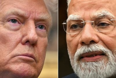 Indian Prime Minister Narendra Modi (R) is slashing consumption taxes as his economy braces for painful US tariffs levied by President Donald Trump