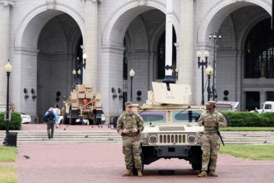Members of the National Guard stand watch outside of Union Station in the US capital Washington, while President Donald Trump has threatened to deploy more troops to other Democratic-led cities like Baltimore and Chicago