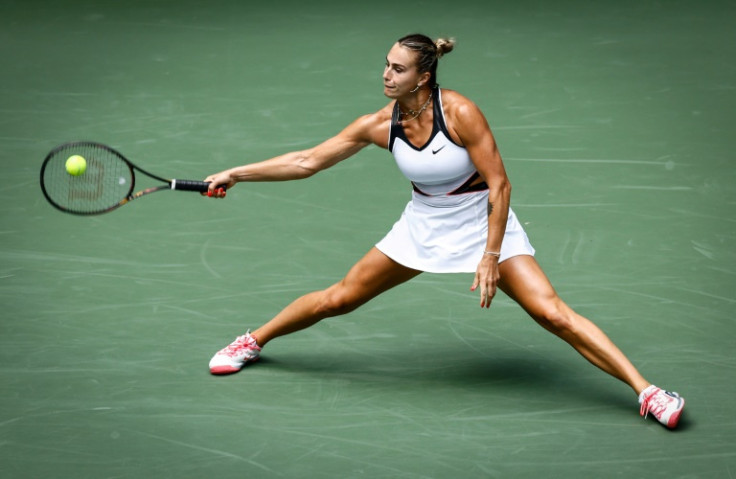 World number one and reigning champion Aryna Sabalenka stretches to return in her US Open first round win over Rebeka Masarova