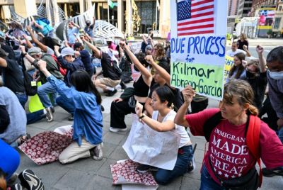 Protestors outside the building where Salvadoran migrant Kilmar Abrego Garcia was arrested by ICE
