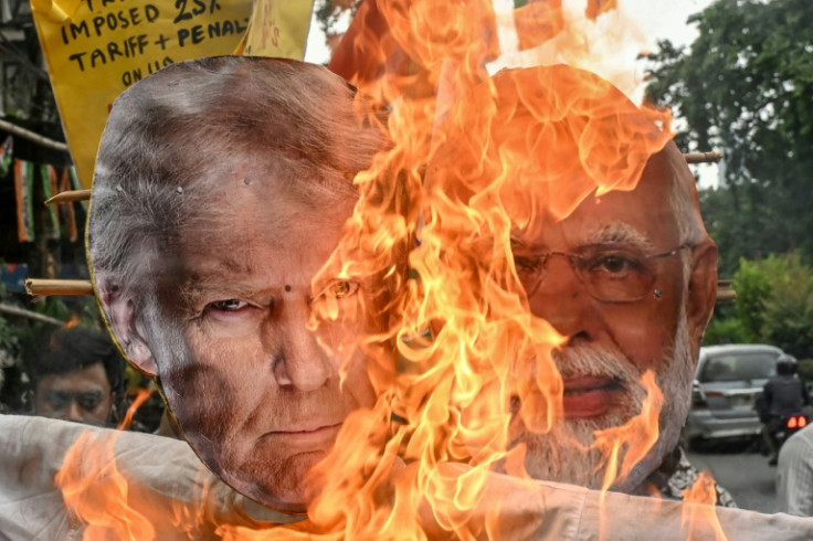 Opposition activists burned an effigy of US President Donald Trump and Indian Prime Minister Narendra Modi earlier this month as negotiations took place under a cloud of US tariffs