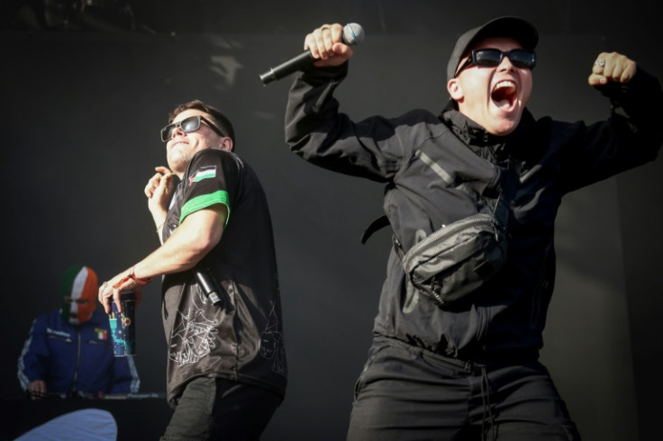 Naoise O Caireallain (C), aka Moglai Bap, and Liam O'Hanna (R), aka Mo Chara, part of the Northern Ireland hip-hop trio Kneecap, have grabbed headlines for statements denouncing the war in Gaza and against Israel