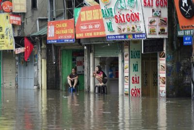 In the capital Hanoi, the heavy rains left many streets under water, bringing traffic chaos
