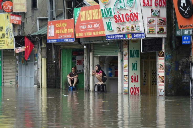 In the capital Hanoi, the heavy rains left many streets under water, bringing traffic chaos