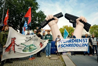 Activists protest against the idea of bringing back compulsory military service, in front of the Defence Ministry in Berlin