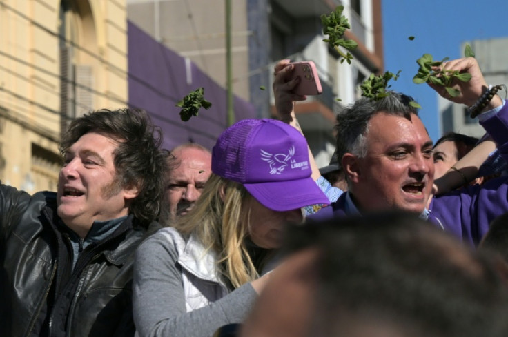Protesters throw plants at Milei his sister, Karina Milei