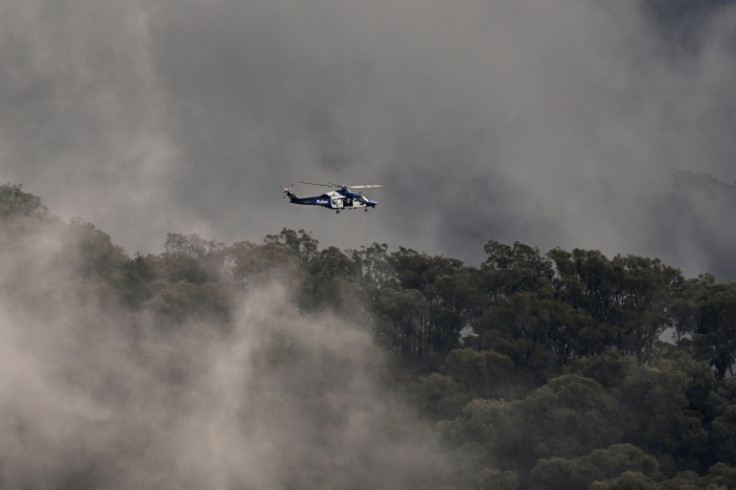Australian police helicopters searched for a gunman suspected of killing two officers