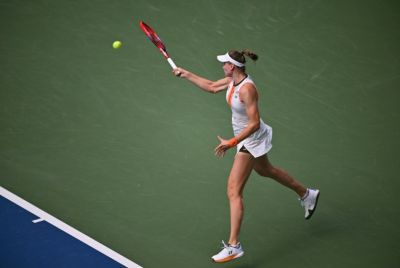 Kazakhstan's Elena Rybakina blasts a return to Emma Raducanu during her US Open third round win over the British former champion