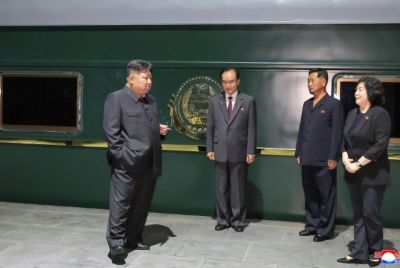 This picture taken on September 1, 2025 and released from North Korea's official Korean Central News Agency via KNS shows Kim outside his train