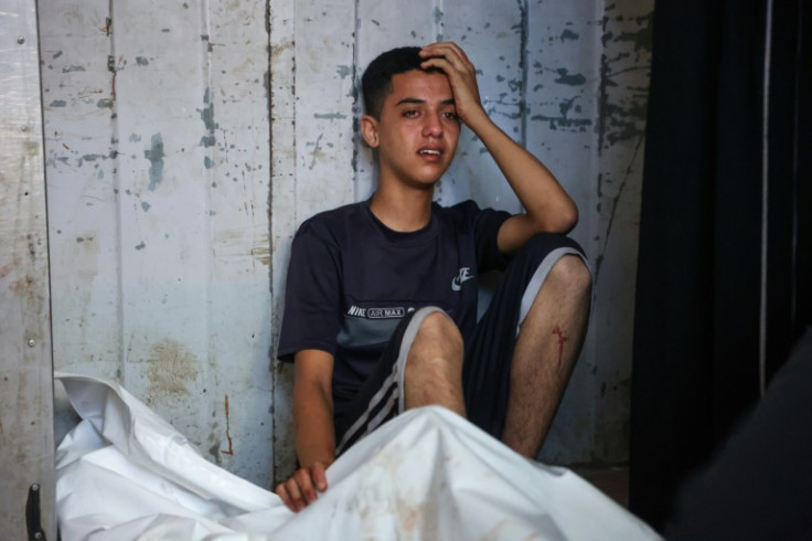 Palestinians mourned over their loved ones at Gaza City's Al-Shifa Hospital following overnight strikes