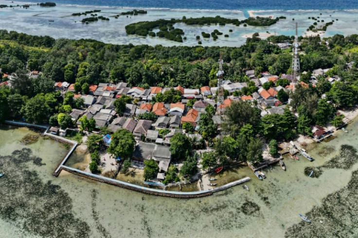 A concrete embankment around parts of Pari island is used to stem rising sea levels
