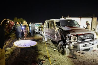 Security personnel inspect a damaged vehicle at the site of an explosion after a suicide bombing in Quetta, Pakistan on September 2, 2025