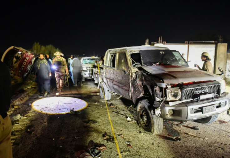 Security personnel inspect a damaged vehicle at the site of an explosion after a suicide bombing in Quetta, Pakistan on September 2, 2025