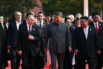 (L-R) Russia's President Vladimir Putin walks with China's President Xi Jinping and North Korea's leader Kim Jong Un before a military parade marking the 80th anniversary of victory over Japan and the end of World War II
