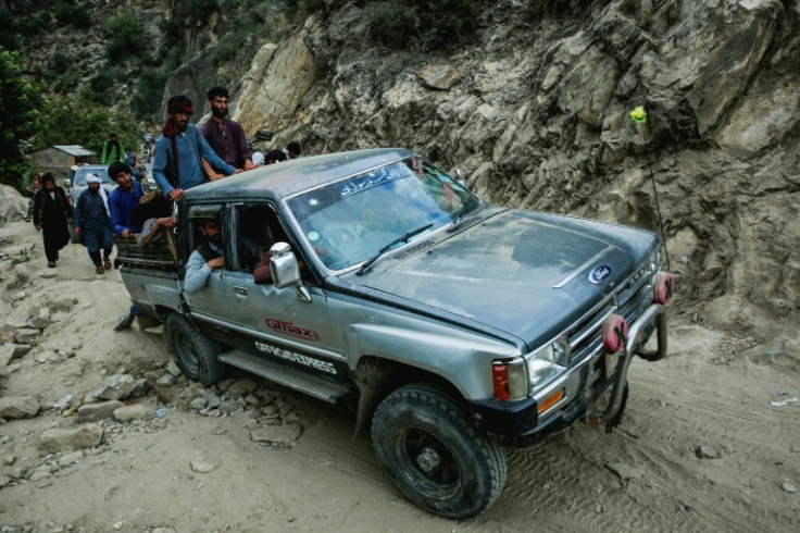 Afghans commute along a hillside, in the aftermath of an earthquake at the Nurgal district of Kunar province on September 3, 2025. Hope was quickly fading of finding survivors in the rubble of homes devastated by the weekend's powerful 6.0-magnitude quake