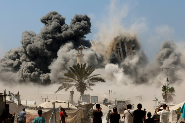 Mushtaha Tower in Gaza City collapses after being hit by an Israeli air strike on Friday