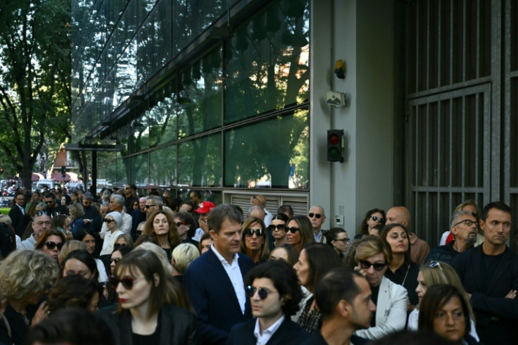 People queue to pay their respects