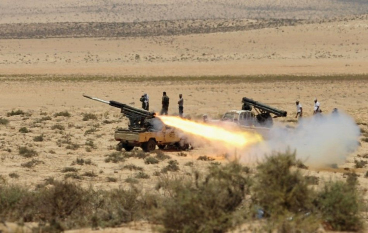 Rebel forces fire artillery guns at Libyan leader Muammar Gaddafi&#039;s troops, 60 km (37 miles) west of Ajdabiyah