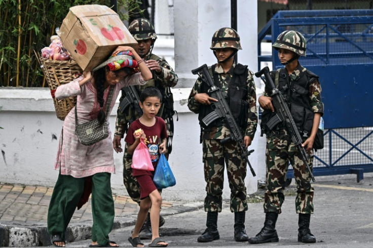 People in Nepal took advantage of a brief lifting of a curfew to stock up on supplies as the president and the army chief met to seek an interim leader in the wake of the worst violence in the Himalayan nation in decades