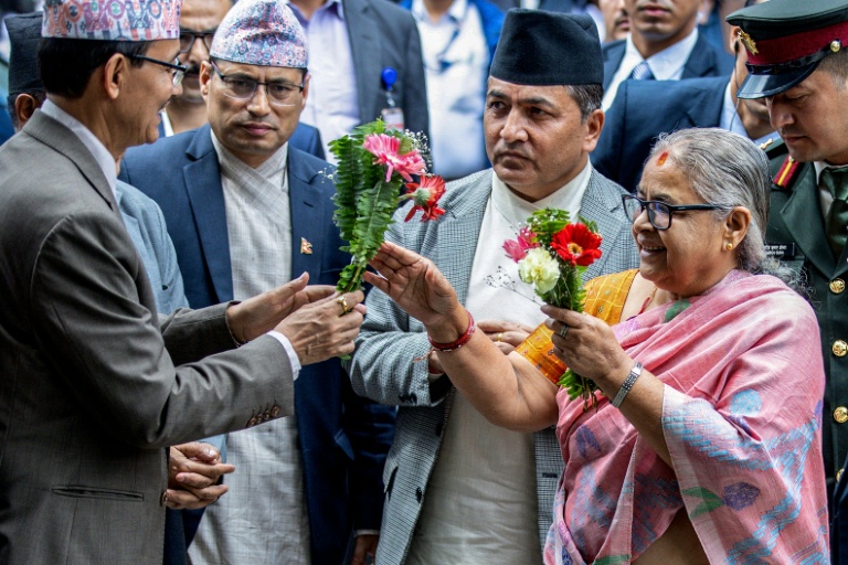 https://d.ibtimes.com/en/full/4621560/officials-greet-nepals-new-interim-prime-minister-sushila-karki-her-office-kathmandu-september.jpg