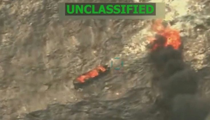 This screen grab from a video posted by US President Donald Trump on his Truth Social account on September 15, 2025, shows what President Trump says is US Military forces conducting a strike on a boat carrying alleged drug traffickers in the Caribbean Sea