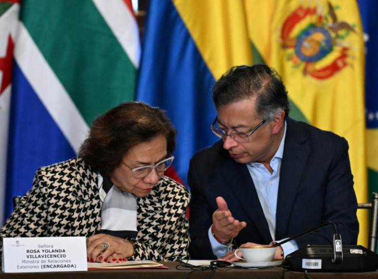 Colombia's President Gustavo Petro talks to his Foreign Minister Rosa Yolanda Villavicencio during the emergency conference of The Hague Group at the San Carlos Palace in Bogota on July 16, 2025. United Nations Special Rapporteur on the Rights Situation i