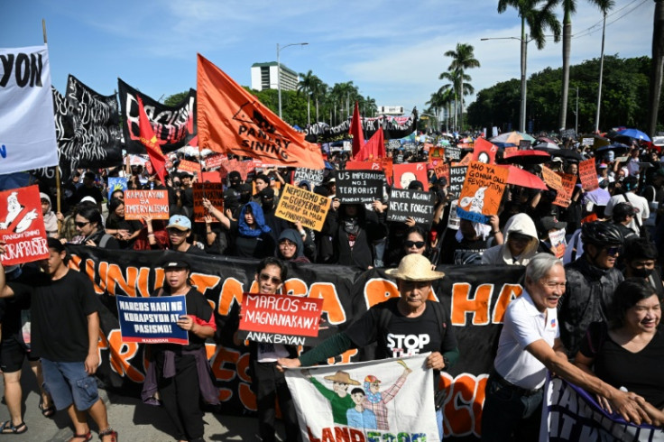 Protesters take part in a rally as they demonstrate against phony flood control projects, one of the country's biggest corruption scandals in decades, in Manila on September 21, 2025.