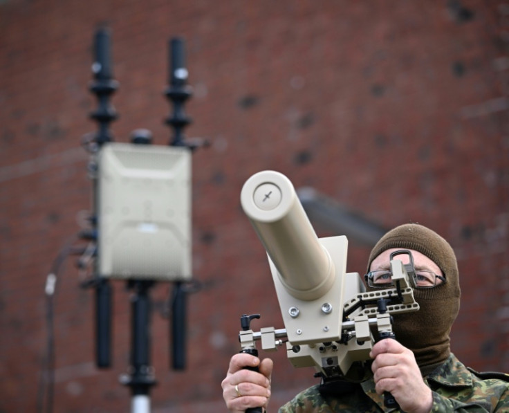 A German soldier uses a handheld drone jammer during a defence exercise in Hamburg