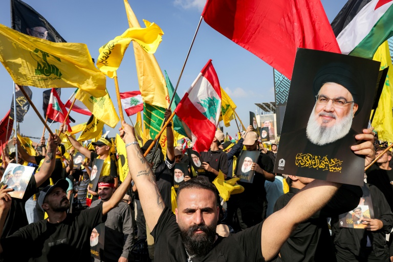 https://d.ibtimes.com/en/full/4624168/hezbollah-supporters-gathered-their-tens-thousands-commemorate-death-hassan-nasrallah.jpg