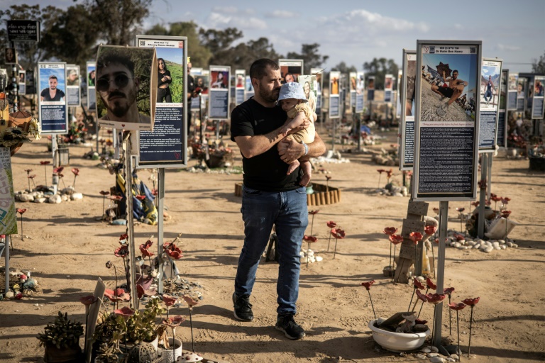 https://d.ibtimes.com/en/full/4627181/man-walks-through-memorial-victims-october-7-attacks-southern-israel-day-before-anniversary.jpg