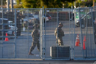 National Guard troops are seen near an entrance to a US Immigration and Customs Enforcement (ICE) detention facility in Broadview, Illinois