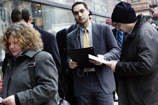 People wait in line to enter the UJA-Federation of New York's Connect to Care job fair in New York.