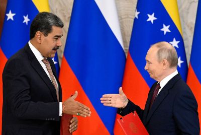 Russia's Vladimir Putin and Venezuela's Nicolas Maduro shake hands