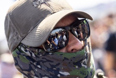ICE official looks on at crowd during LA raid