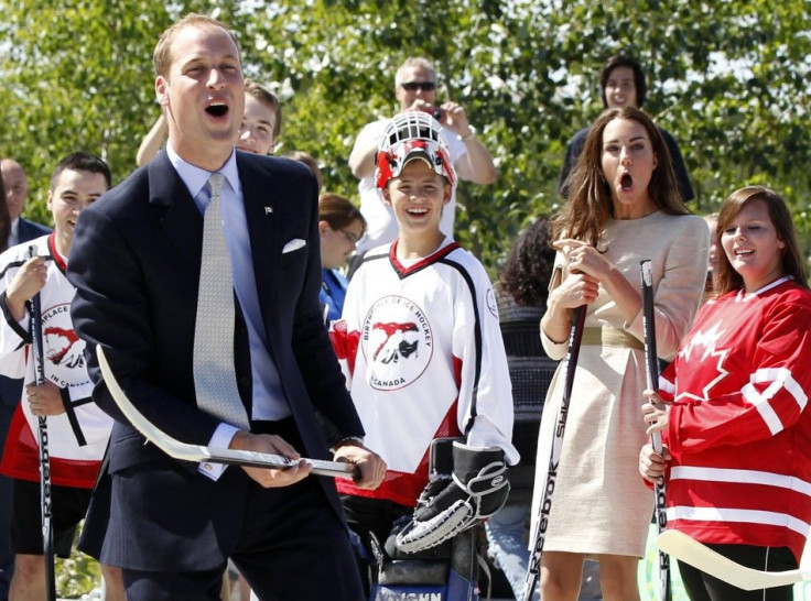 Britain&#039;s Prince William and his wife Catherine, the Duchess of Cambridge, react during visit to Somba K&#039;e Civic Plaza in Yellowknife