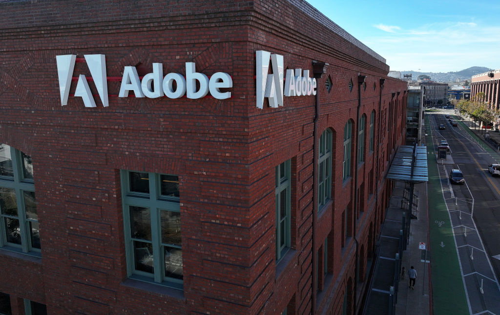 https://d.ibtimes.com/en/full/4645421/adobe-unveil-new-terms-service-after-ai-model-training-concerns.jpg