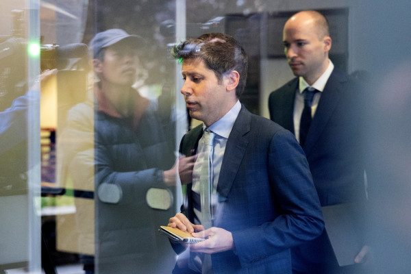 OpenAI CEO Sam Altman, center, and OpenAI President Gregory Brockman