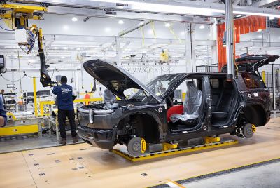 Workers assemble Rivian R2 SUVs