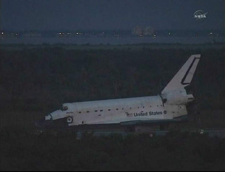 The space shuttle Atlantis sits on the runway in the early morning light after a night landing at the Kennedy Space Center in Florida in this image from NASA TV July 21, 2011.