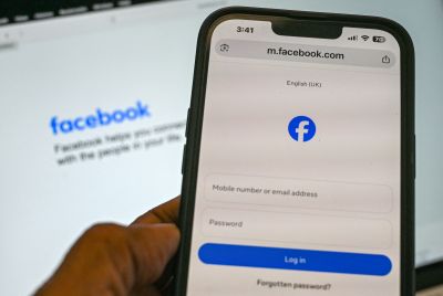 A phone screen on the Facebook log-in page