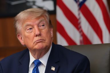 U.S. President Donald Trump listens to questions from reporters