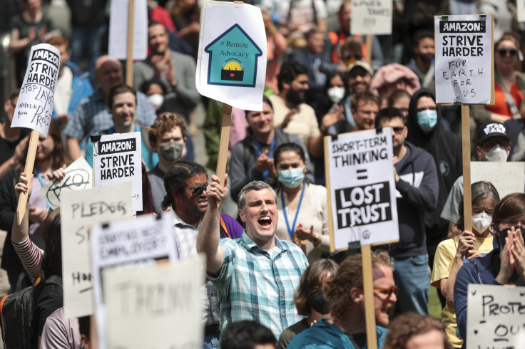 Amazon employees and supporters gather during a walk-out protest