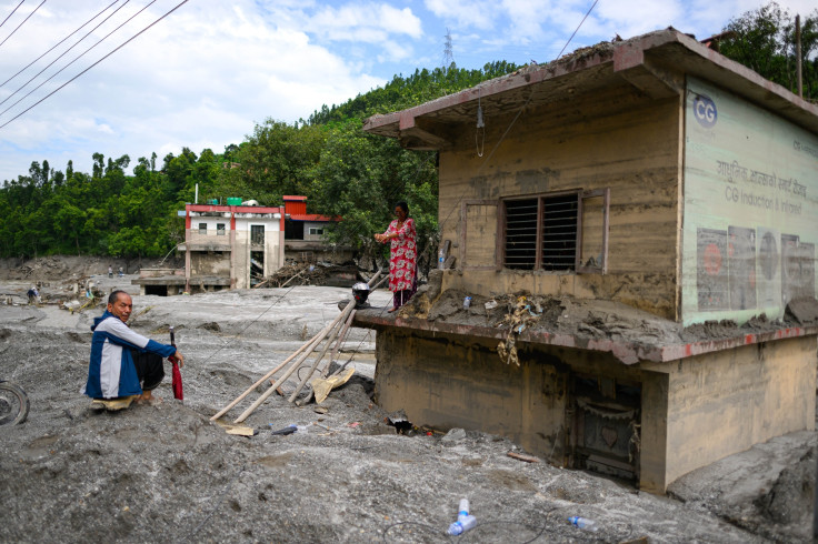 Nepal Flood Survivors Amid Mud-Covered Homes