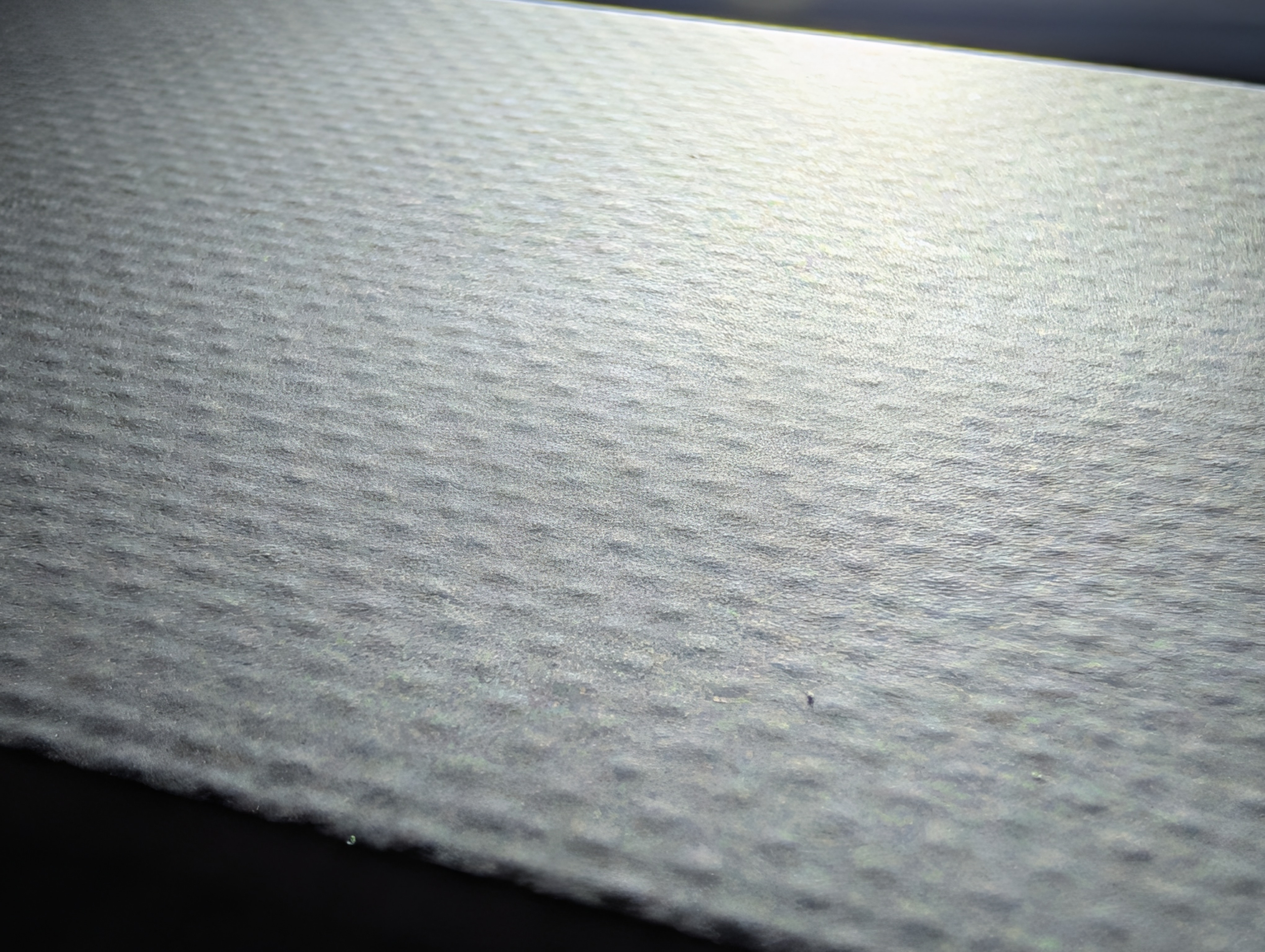 A close-up of the Latercase surface under angled light reveals