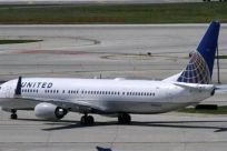 A United Airlines plane with the Continental Airlines logo on its tail, taxis to the runway at O'Hare International airport in Chicago